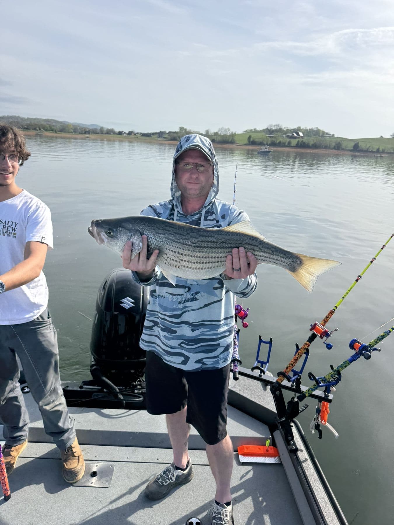 Father and son with a fish