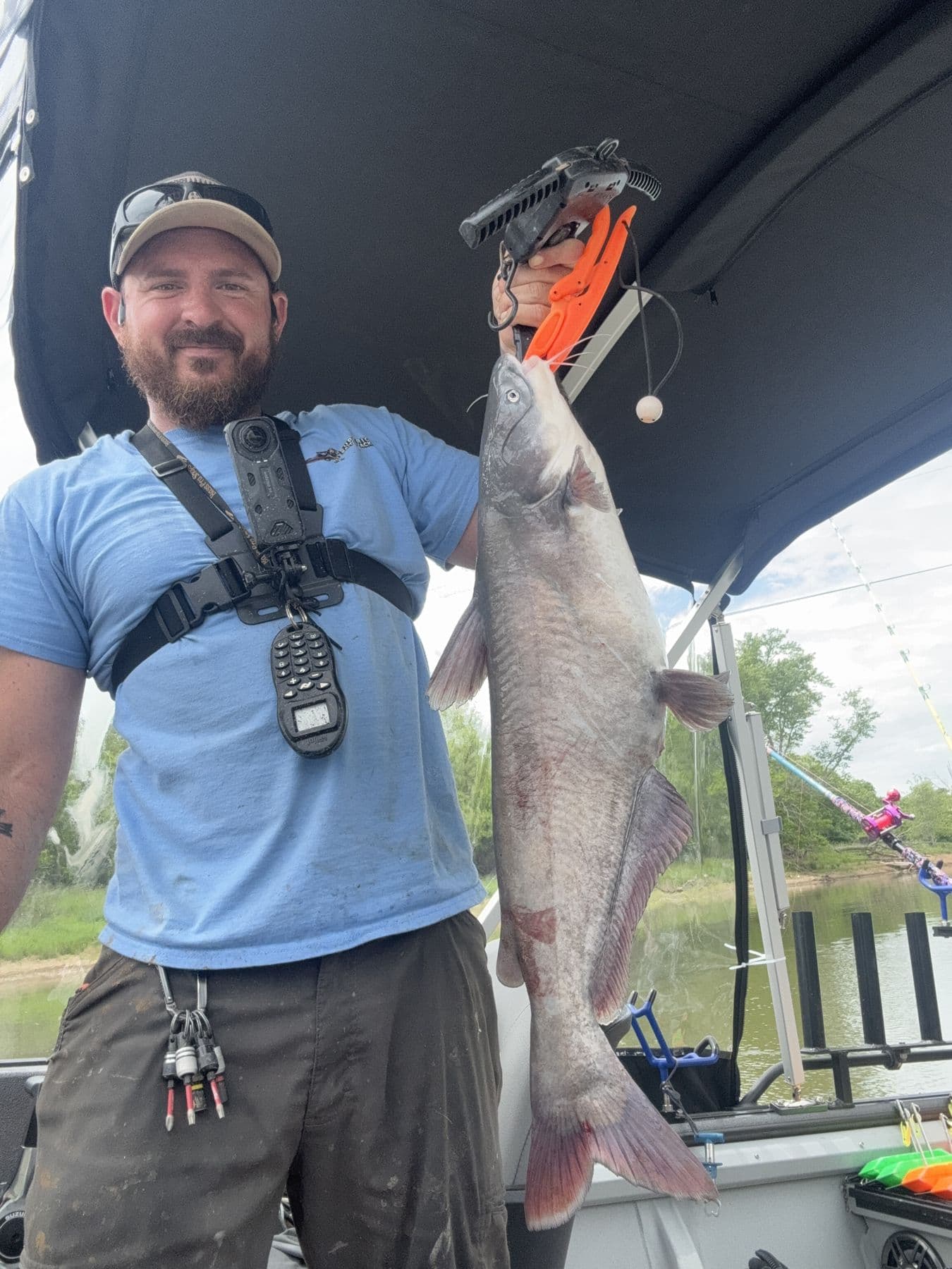 A big fish held high